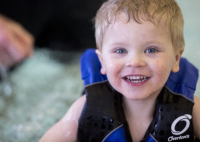 Toddler smiles on the pool
