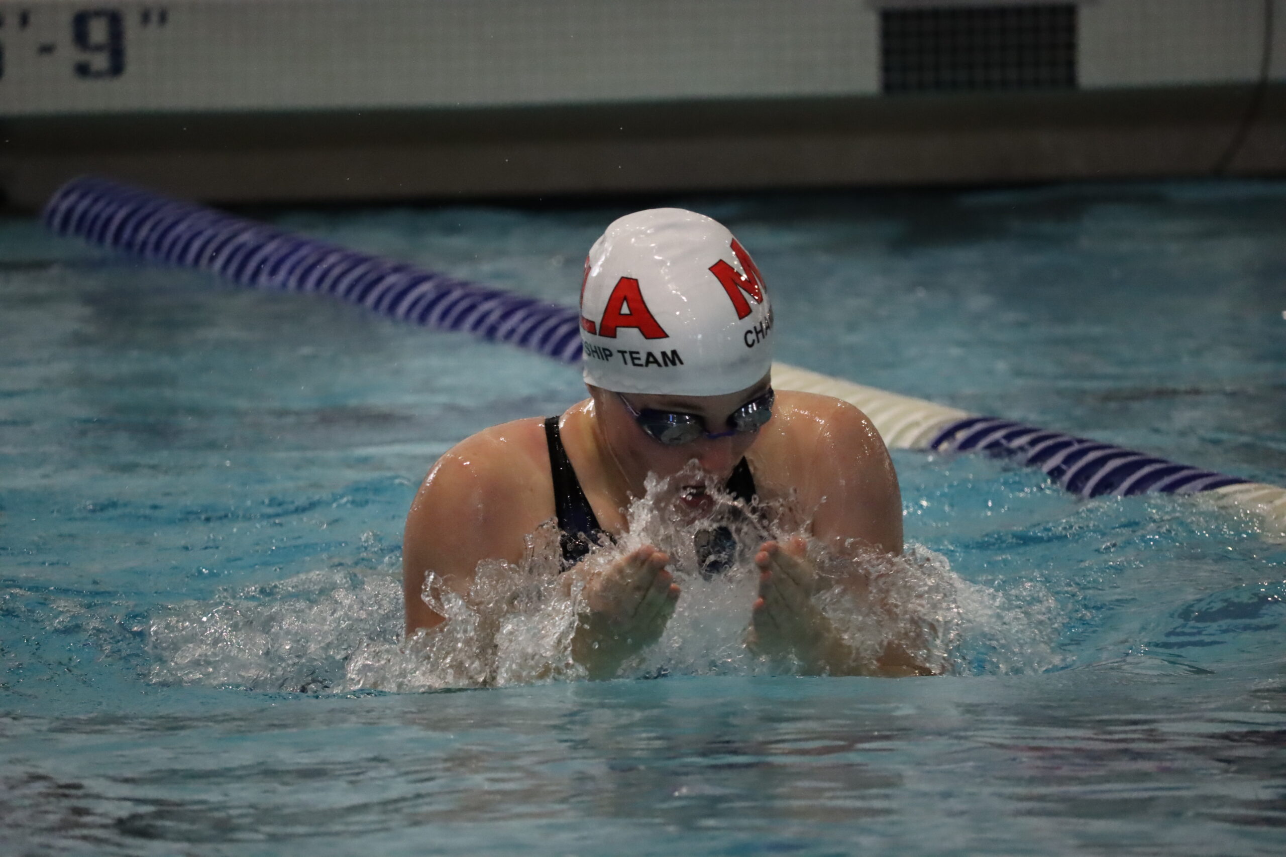 A MLA female butterflyer competes